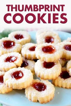 there is a plate full of cookies with jam on them and the title reads, thumbrint cookies