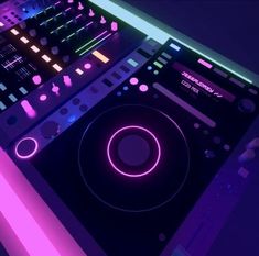 a dj mixer with neon lights on it's side and the sound board in front