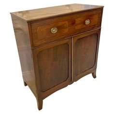 an old wooden cabinet with two doors on one side and three drawers on the other