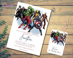 the avengers birthday party is set up on a wooden table with an envelope and greeting card