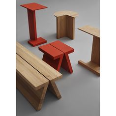 an assortment of wooden benches and stools in various shapes and sizes, all with different colors