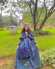 This gorgeous handwoven and embroidered garment showcases a magnificent combination of artistry, cultural heritage, and exquisite craftsmanship. This stunning piece is carefully crafted using Fetil, a type of cotton fabric, and thread material, resulting in a truly remarkable ensemble that radiates beauty and elegance. At the heart of this garment lies the handwoven Fetil fabric, carefully woven by skilled artisans using traditional techniques passed down through generations. Fetil cotton, known Traditional Long Dress With Traditional Patterns, Traditional Long Handloom Dress, Traditional Embroidered Long Dresses, Festive Dresses For Traditional Ceremonies With Weaving Work, Folk Style Dresses With Woven Motifs For Festive Occasion, Traditional Long Embroidered Dress, Traditional Dresses With Multicolor Embroidery And Woven Motifs, Folk Style Festive Dresses With Woven Motifs, Traditional Festive Dress With Weaving Work