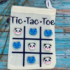 a tic - tac - toe bag with panda bears on it