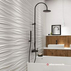 a modern bathroom with white walls and wood accents on the shower head, tub, and sink