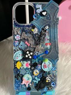 a cell phone case with various items on it