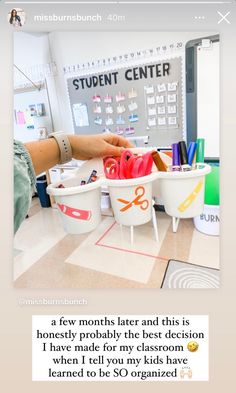 someone is doing something on the floor with scissors and cups in front of them,