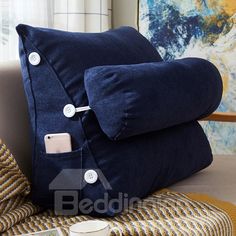 a blue pillow sitting on top of a couch