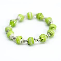 a green beaded bracelet with silver beads