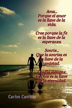 two people holding hands walking on the beach with words written in spanish and english above them