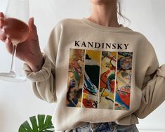 Gildan 18000 **If you are S get M or L for loose-oversized look. If you are L get XL or 2XL. If your size is not in stock please reach out so we can double check for you. **Apparel/design colors may vary across devices. Ideal for any situation, a unisex heavy blend crewneck sweatshirt is pure comfort. These garments are made from polyester and cotton. This combination helps designs come out looking fresh and beautiful. The collar is ribbed knit, so it retains its shape even after washing. There Artistic Oversized Graphic Tops, Artistic Oversized Fall Tops, Artistic Oversized Crew Neck Sweatshirt, Artistic Relaxed Fit Sweatshirt For Fall