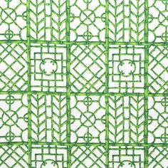 a green and white wall with many different designs on it