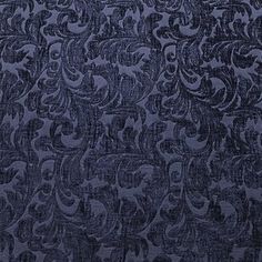 an upholstered blue fabric with intricate designs