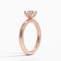 a rose gold engagement ring with two diamonds on top