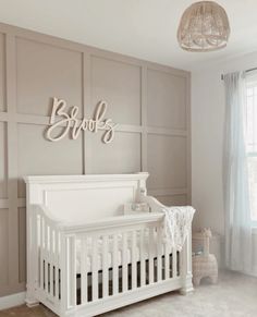 a white crib in the corner of a room