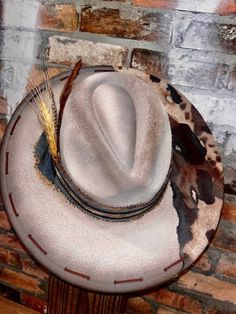 **Variations in materials used due to each hat being custom hand made. Design of hat will remain as close to original as possible** 100% polyester One Size Fits MOST. If you do not see a style you like, shoot us a message and we will try to create your vision!! Custom Brimmed Fedora For Ranch, Artisan Ranch Hat With Short Brim, Artisan Fitted Hats For Ranch, Artisan Hat With Short Brim For Ranch, Fitted Artisan Ranch Hats, Artisan Short Brim Hat For Ranch, Artisan Style Brimmed Hats For Ranch, Custom Flat Brim Felt Hat For Western-themed Events, Custom Flat Brim Fedora For Western-themed Events