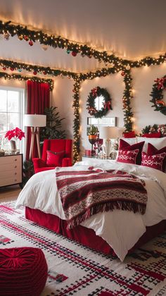 a bedroom decorated for christmas with red and white decorations on the walls, lights strung from above