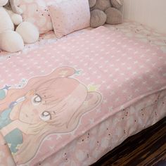 there is a bed with pink sheets and teddy bears on it