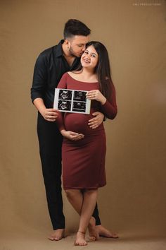 a man and woman are posing for a photo