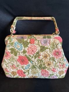 Vtg Quilted fabric Gold stitched floral design Pastel  Top handle  Metal frame constructed  11' width 8 1/2 height - with 3' metal rectangular frame fabric  top handled  3' bottom base width  9 1/2 'top bag extension opening  Ivory fabric interior lined  2 squared lined interior pouches on each side  Metal top lift clasp & closure  Unbranded  Excellent condition Vintage Green Satchel With Double Handle, Green Vintage Satchel With Double Handle, Vintage Green Double Handle Satchel, Vintage Pink Handheld Bag, Vintage Pink Shoulder Bag With Handles, Pink Vintage Shoulder Bag With Handles, Vintage Floral Print Bag For Daily Use, Vintage Floral Print Shoulder Bag For Spring, Spring Vintage Floral Print Shoulder Bag