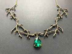 Enchanted forest necklace with a green jewel, Selma Dreams Nature-inspired Green Pendant Crystal Necklace, Green Tree Of Life Jewelry Gift, Nature-inspired Green Jewelry For Jewelry Making, Forest Necklace, Cascade Necklace, Branch Necklace, Diamond Face, Necklace Green, Turquoise Glass