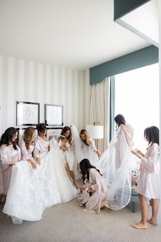 The morning of was a buzz of joy and excitement as the bridesmaids and Crystal prepped in the bridal suite. In matching blush satin robes and slips, they admired the lace details on her gown and soaked up all of the one-in-a-lifetime memories in the making. #weddingmorning #weddingparty #weddingdress #bridesmaids Beverly Hills Style, Beverly Hills Wedding, Pastel Bridesmaid Dresses, Satin Robes, Lace Bridesmaid Dresses, Short Bridesmaid Dresses, Bridal Suite, Morning Wedding, Getting Ready