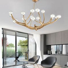 an elegant chandelier hangs from the ceiling in a modern living room with glass doors