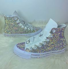 "Add Some Sparkle To Your Wedding Day, Anniversary, Birthday Party, Sweet 16, Social Event Or Prom With These Authentic Custom Bling HighTop All Star Converse Encrusted With High Quality Crystals.                 ✨💎 PLEASE NOTE 💎✨ IF YOU WOULD LIKE BLING LACES OR SATIN LACES YOU MUST SELECT THAT OPTION FROM THE DROP DOWN AND ADD IT TO YOUR CART AS WELL. IF YOU DO NOT ADD ANY OF THOSE OPTIONS YOUR SHOES WILL COME WITH THEIR ORIGINAL LACES ONLY❗️ Each Pair Of Sneakers Comes With: * Carrying Sneaker Bag (Original Box NOT Included ) * Their Original laces * Small Repair Kit Interested In A Different Color? No Worries. Simply Contact Us With The Color Of Your Choice And We'll Be More Than Happy To Assist You. SIZES: Sneakers Are in U.S Sizes. PLEASE NOTE Converse Runs 1/2 Size Bigger. Make Su Navy Blue Bling Converse, Purple Bling Converse, Shoes For Prom Sneakers, Prom Tennis Shoes, Diamond Converse, Prom Sneakers, Bedazzled Sneakers, Bling Converse Shoes, Birthday Party Sweet 16