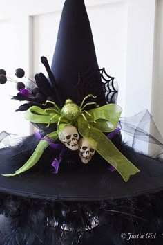 a witches hat with two skulls on it