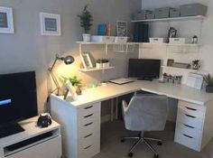 a white desk topped with a computer monitor next to a chair and shelves filled with books