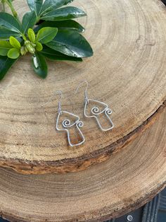 Elevate your style with our wire-wrapped mushroom earrings--each one a tiny masterpiece of whimsy and craftsmanship. Embrace the enchanting charm of nature, effortlessly adorning your ears with a touch of woodland magic.  Wrapped in silver plated wire or sterling silver 💫 Silver plated earrings are adorned with surgical steel hypoallergenic hooks 🌸  Sterling silver earrings are adorned with sterling silver hooks 🌸   Check out my etsy for other unique treasures! ✨ 🔮 -------------------- Follo Adjustable Wire Wrapped Whimsical Earrings, Whimsical Adjustable Wire Wrapped Earrings, Whimsical Wire Wrapped Metal Earrings, Bohemian Dangle Jewelry With Mushroom Design, Whimsical Wire Wrapped Drop Earrings, Silver Wire Wrapped Nature-inspired Earrings, Bohemian Dangle Earrings With Mushroom Design, Nature-inspired Sterling Silver Wire Wrapped Earrings, Nature-inspired Wire Wrapped Sterling Silver Earrings