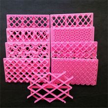 several pink plastic pieces are stacked on top of each other in the shape of lattices