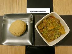 two plates with food on them sitting on a table next to another plate that has a cookie in it