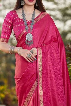 This Saree is Ready to Wear (With Fall and Pico Done). A designer saree in Pink Color. It has intricate design all over the saree. This saree is a suitable amalgamation of style and grace that is required from an ethnic wear. The saree is ideal for any formal gathering. The saree comes with an unstitched blouse of corresponding color and design as shown in the picture. Banarasi Silk Designer Pink Color Saree Fabric Type: Banarasi Silk Satin Primary Colour: Pink Saree Length: 6.3 meters including 0.8 meter blouse Blouse Material: Matching Silk Washing Instructions: Dry Clean Only Wedding Pre-draped Saree With Printed Border, Festive Pre-draped Saree With Printed Border, Elegant Traditional Wear With Printed Border For Navratri, Elegant Saree With Printed Border For Navratri, Eid Banarasi Silk Saree With Printed Border, Elegant Navratri Saree With Printed Border, Traditional Drape Choli With Printed Border, Traditional Wear With Printed Border For Wedding Diwali, Traditional Wear For Wedding And Diwali With Printed Border