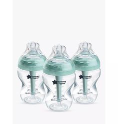 three baby bottles are shown in the shape of an infant's pacifiers