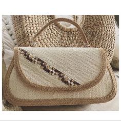 Brand New Very Pretty & Unique Rectangular Ivory Straw Handbag. Made With Organic Tightly Woven Straw With Beautiful Woven Detailing This Is A High Quality Bag That Will Last Pair With Your Summer Dress For A Casual Look Or Dress Up For A Summer Wedding Or Evening Out W 10" H 6" D 3.5" Organic Tightly Handwoven Straw Natural Weave Strong Handles Attached With Silver Metal Hoops Interior Zip Pocket Exterior Back Pocket Magnetic Top Flap Closure Soft Peach Fabric Lining Handcrafted In Thailand White Crochet Travel Bag With Top Handle, Everyday White Handheld Straw Bag, White Handheld Straw Bag For Everyday Use, White Straw Bag With Top Carry Handle, White Straw Bag With Top Carry Handle For Vacation, White Straw Bag With Top Handle, White Handheld Straw Bag With Braided Handles, White Straw Bag With Detachable Handle, White Top Handle Straw Bag With Detachable Handle