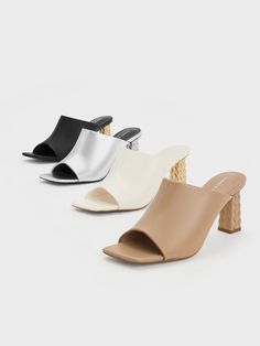 Set yourself apart from the crowd with shoes that command attention from the moment you slide them on. These heeled mules definitely deserve your attention. With a metallic silver finish that captivates wherever you go and distinctively unique gold-toned quilted heels, these mules make a sartorial statement. Heel Mules, Charles Keith, Heeled Mules, Open Toe, Clogs, Metallic Silver, Gold Tones, Heels, Silver