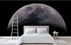 a bedroom with a large moon on the wall and a ladder to reach it's head