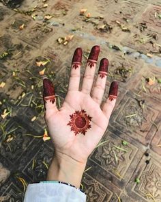 a woman's hand with hendix painted on it, holding out her palm