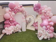 balloons and flowers are arranged in the shape of numbers