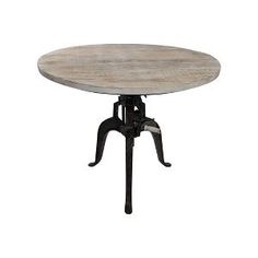 a round table with an iron base and wood top, sitting on a white background