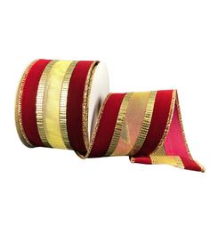 two rolls of red and gold striped ribbon on white background, with one roll in the middle