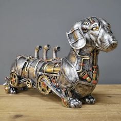 a metal dog sitting on top of a wooden table