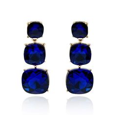 Add a touch of elegance to any outfit with these exquisite Sapphire triple cushion cut crystal earrings. Featuring a trio of brilliantly cut crystals, these earrings are designed to shine whether you’re pairing them with a casual white t-shirt or elevating your look for a gala affair. Their timeless design and ease of wear make them a versatile accessory, perfect for effortlessly enhancing your wardrobe with a hint of sophistication. Avoid contact with water and cosmetics, such as creams or perfumes. Clean with a clean dry cloth. Comes with a velvet pouch. Sapphire Drop Earrings, August Birthstone Jewelry, July Birthstone Jewelry, Jewelry Ring Box, Men's Jewelry Rings, Pearl Jewellery Earrings, Velvet Pouch, Evil Eye Jewelry, August Birth Stone