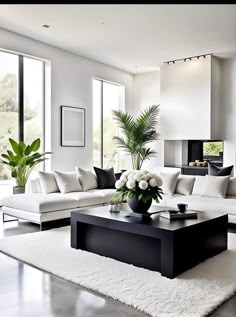 a living room filled with white furniture and lots of window sill space next to a plant