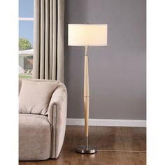 a living room scene with focus on the floor lamp