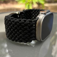 "Handcrafted with 100% Nylon Paracord \"MADE IN USA\".   Our Products include:    ➖Custom handcrafted watch bands \"According to You\". No matter how small or big your wrist size, we will craft your perfect fitting band (wrist size picture measurement required).  ➖Variety of styles to choose from. You may order your band \"As pictured\", or feel free to request changes. If you don't see your favorite style in our page or watch category yet, please contact us and we can discuss your options.  ➖Variety of buckles or clasps (Prices may vary).  ➖FREE FIRST CLASS USPS SHIPPING FOR DOMESTIC U.S. ORDERS (Includes U.S. Military APO/FPO Address Overseas).  Please, refer to policies for handcrafting time frames https://www.etsy.com/shop/Cording2U#policies. These may vary month to month depending on Adjustable Black Apple Watch Band For Everyday, Adjustable Durable Black Apple Watch Band, Adjustable Black Band Apple Watch For Everyday, Handmade Black Apple Watch Band For Outdoor, Handmade Adjustable Black Apple Watch Band, Custom Black Apple Watch Band With Bracelet Strap, Handmade Black Apple Watch Band As Gift, Handmade Black Apple Watch Band For Gift, Custom Black Adjustable Apple Watch Band