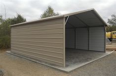 a large metal garage sitting in the middle of a parking lot