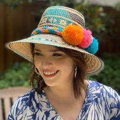 Handwoven Turquoise, Brown And Natural Straw Hat With A Wide Brim And Interior Band. Each Of Our Artisan Hats Is Unique And Takes Approximately 8-10 Hours To Hand Weave By Skilled Artisans In The Guajira Desert Of Colombia. Pair With One Of Our Handwoven Pom-Pom Hat Bands For A Fun Pop Of Color. Pom Pom Hat Bands Are Available In A Variety Of Colors And Are Sold Separately. Comment Below If You're Interested In Purchasing A Pom Pom Hat Band And We Will Let You Know What Colors We Have Available. Green Fun Sun Hat For Vacation, Fun Green Sun Hat For Vacation, Casual Multicolor Woven Panama Hat, Multicolor Woven Brimmed Straw Hat, Turquoise Summer Hats, Summer Multicolor Handwoven Hats, Multicolor Woven Hats For Spring, Multicolor Flat Brim Hat For Vacation, Multicolor Woven Hat For Vacation