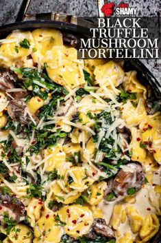 a skillet filled with pasta, mushrooms and spinach