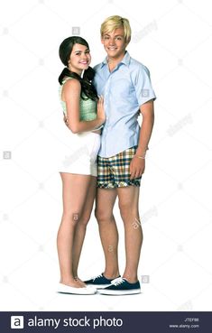 a young man and woman posing for the camera with their arms around each other's shoulders